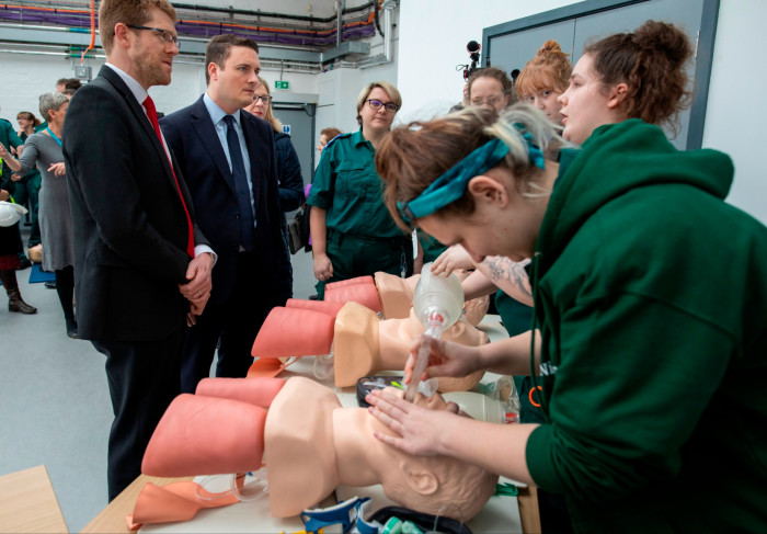 Wes Streeting watches paramedic students practising CPR on dummies at University of Worcester