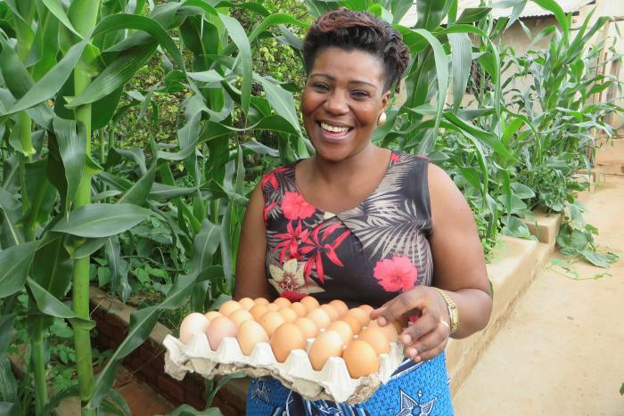 Silverlands Tanzania employee Ada Joseph Magelenga holding a tray of eggs