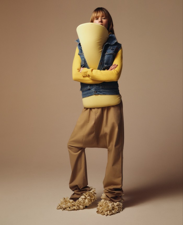 Martine Rose denim gilet, POA. Loewe padded-cotton drill top, £795, and wool zip-up hoodie, £1,100, cotton drill low-crotch trousers, £795, and satin Comic Balloon pumps, £1,400