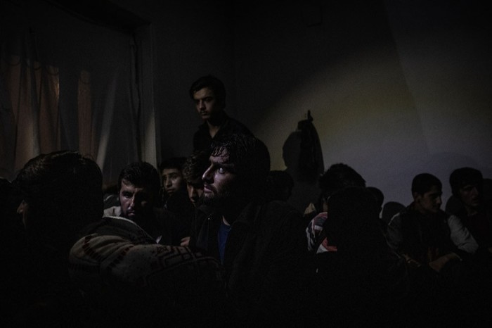 Afghan migrants waiting to be removed from a smuggler’s safe house in Turkey, after a police raid in July.