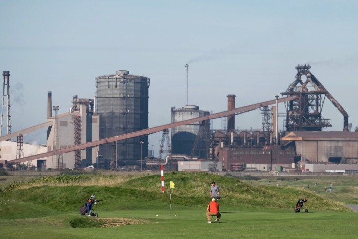 Golfers play next to the steel furnace in Redcar. The final owner of the vast plant overlooking the Tees estuary was Sahaviriya Steel Industries UK, the subsidiary of a Thai steel-maker