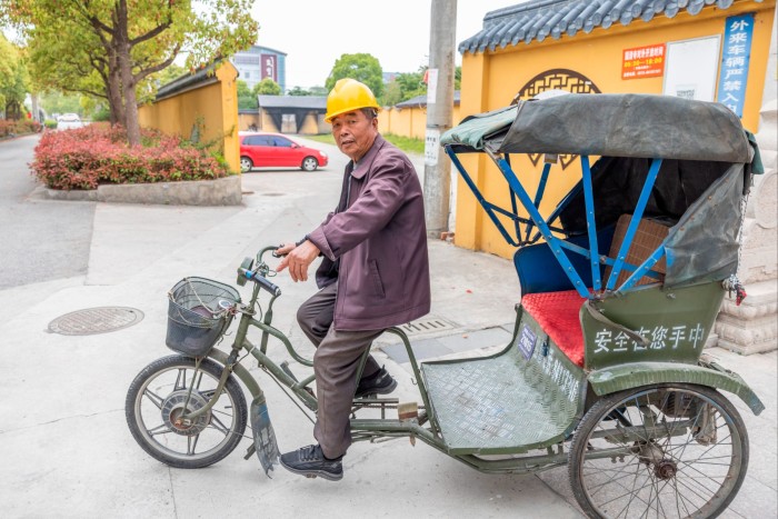 A tricycle taxi driver in Rudong