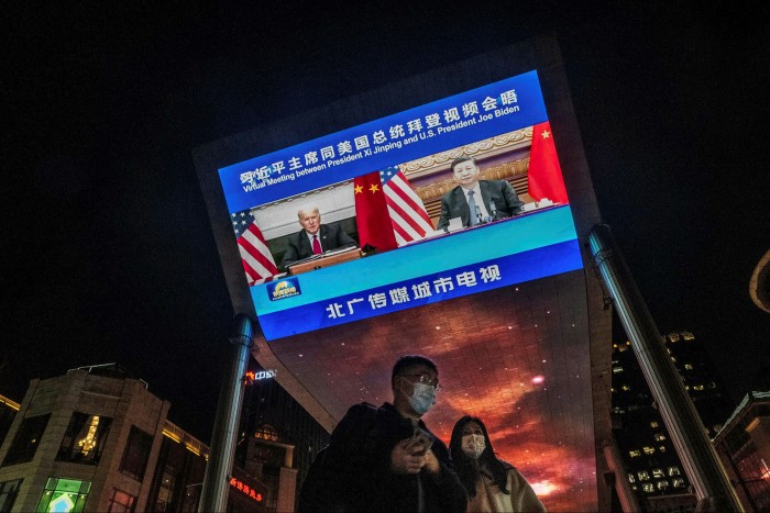 Looming tensions: a screen in Beijing displays a virtual meeting between US president Joe Biden and Chinese president Xi Jinping in November 2021