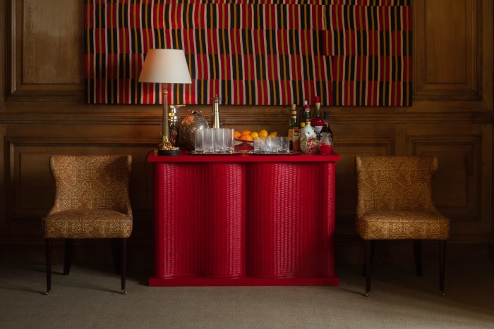 Rooms take on a richer flair – think Mayfair gentlemen’s club without the stuffiness. Soane Britain’s rattan Kymo cabinet in scarlet teamed with its sgraffito linen (£250 per metre, pictured edge of page) by dealer and designer Adam Bray nails the eclectic aesthetic