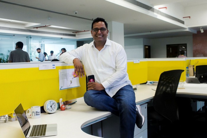 Vijay Shekhar Sharma, CEO PayTM, poses for a photograph on his desk at the PayTM office in Noida, Uttar Pradesh, India