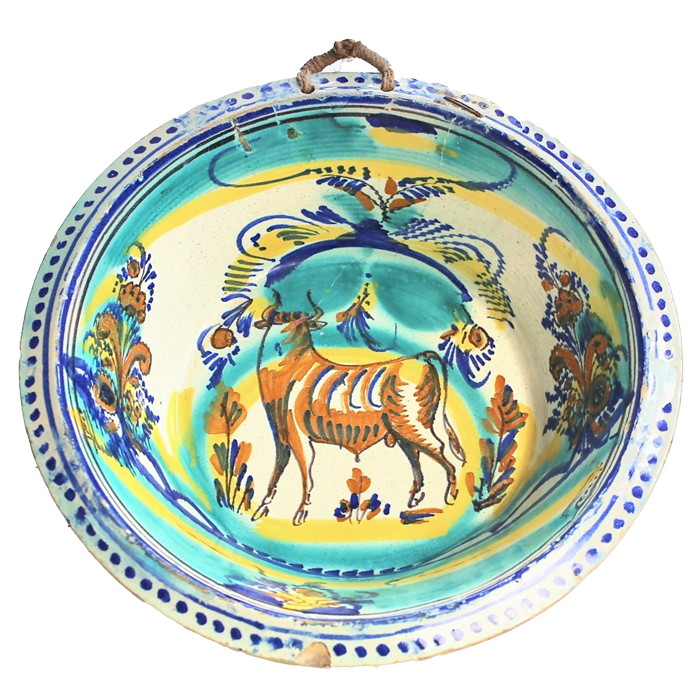blue and yellow painted ceramic bowl with bull design