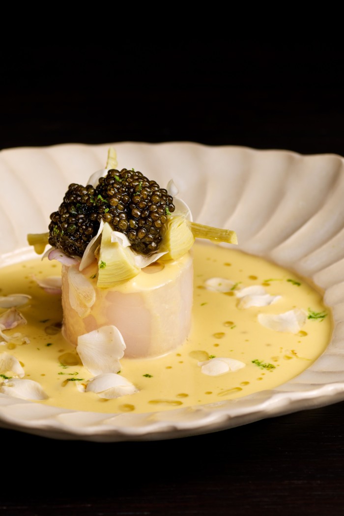 Cod with caviar and white rose petals at Terre Restaurant, overseen by chef Vincent Crepel 