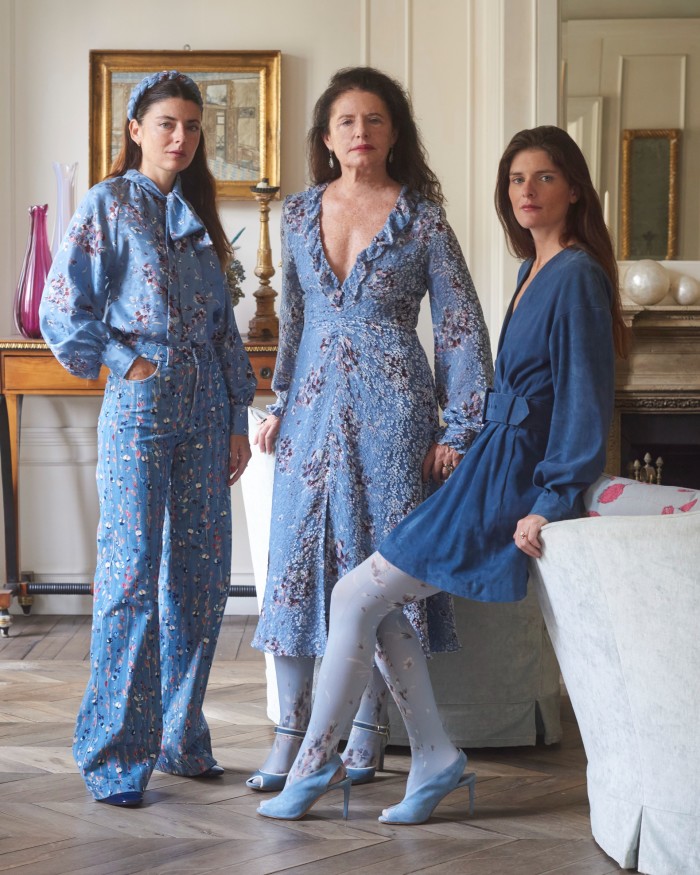 With two of her daughters, Lucilla (left), co-designer at the brand and Luna (right), digital director