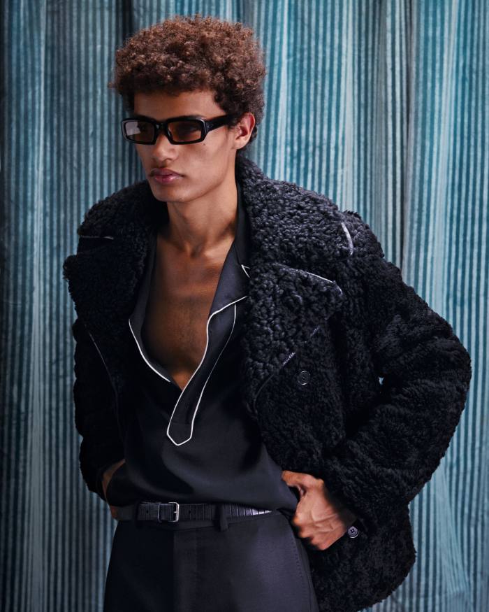 Saint Laurent by Anthony Vaccarello aged-leather shearling coat, £5,225, wool Western tunic, £810, and leather belt, £220. Dunhill silk trousers, £795. Port Tanger acetate Mektoub sunglasses, £265