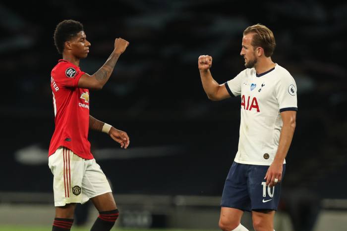 Man Utd’s Marcus Rashford and Tottenham captain Harry Kane at the end of the game. As part of the new regime, handshakes are out and goal celebrations are supposed to be solitary affairs