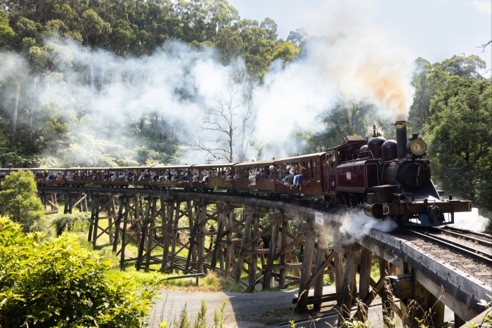 The Puffing Billy steam train crossing the wooden Trestle Bridge 
