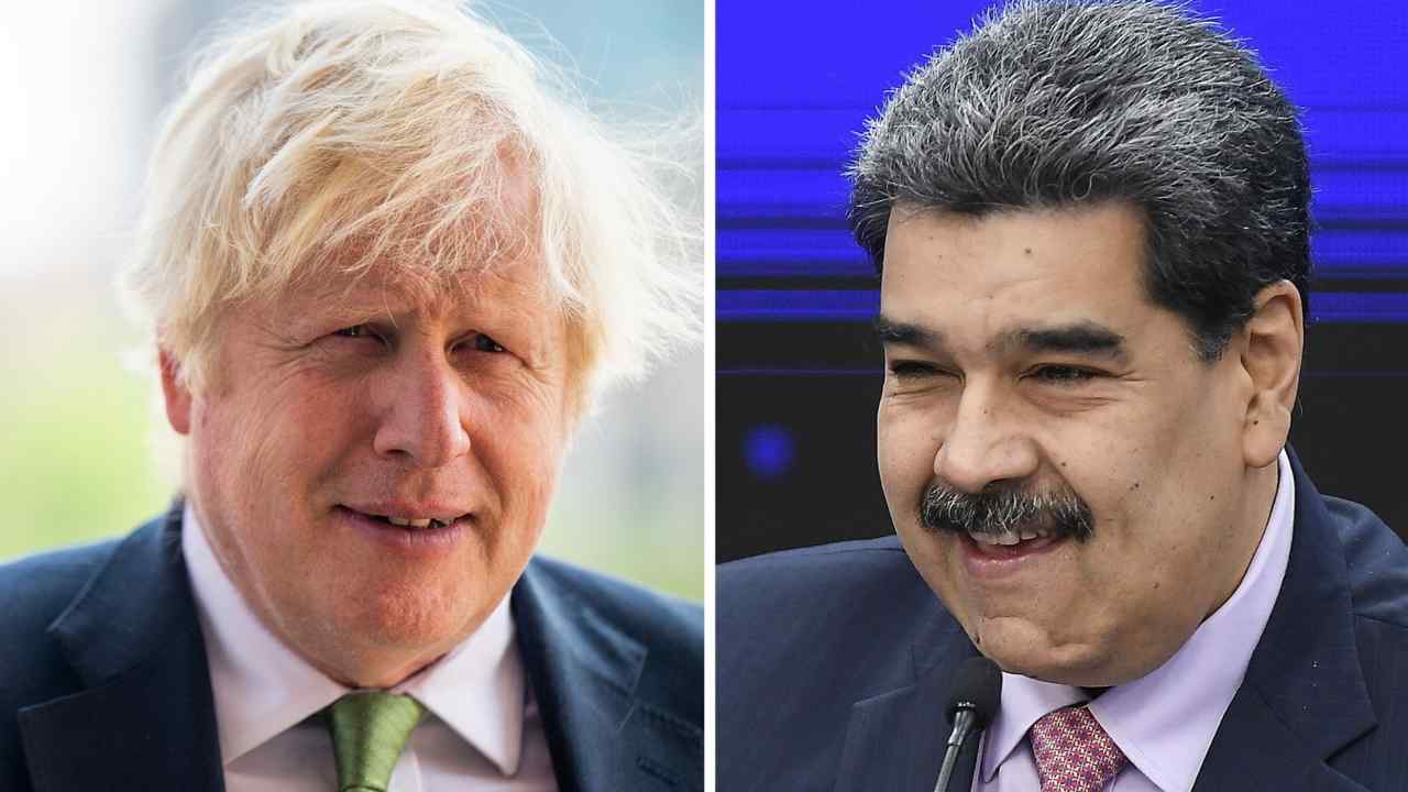 Former UK Prime Minister Boris Johnson, left, and Venezuelan leader Nicolás Maduro