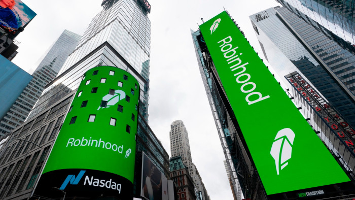 Electronic screens in New York’s Times Square show the Robinhood company logo