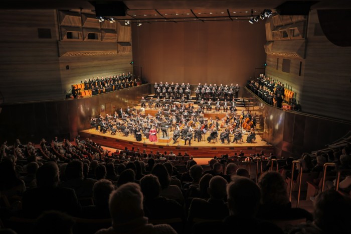 Audience-perspective shot of the Melbourne Symphony Orchestra performing at Hamer Hall