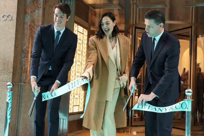 Alexandre Arnault with actress Gal Gadot and Anthony Ledru lead the ribbon cutting at a luxury goods store