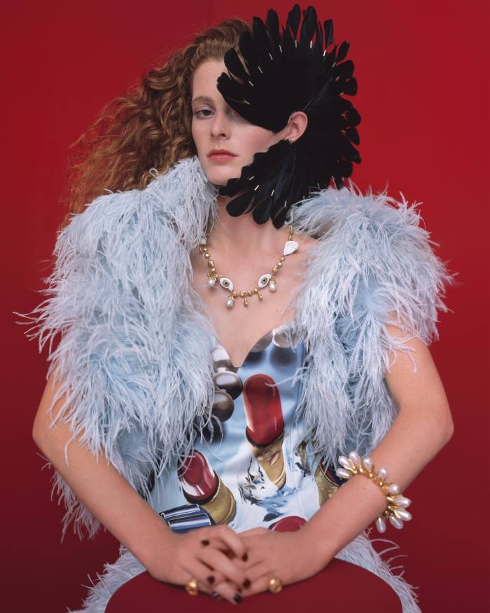 Lanvin feather bolero, £5,582, matching skirt, POA, and silk and technical-fabric Rosenquist cape bustier, £5,156. Shaun Leane silver and feather Fan earring, pair created for Alexander McQueen SS03 show, POA. Schiaparelli brass, shell and pearl necklace, £2,200, brass and pearl bracelet, POA, and brass Zodiac Cancer and Virgo rings, £300