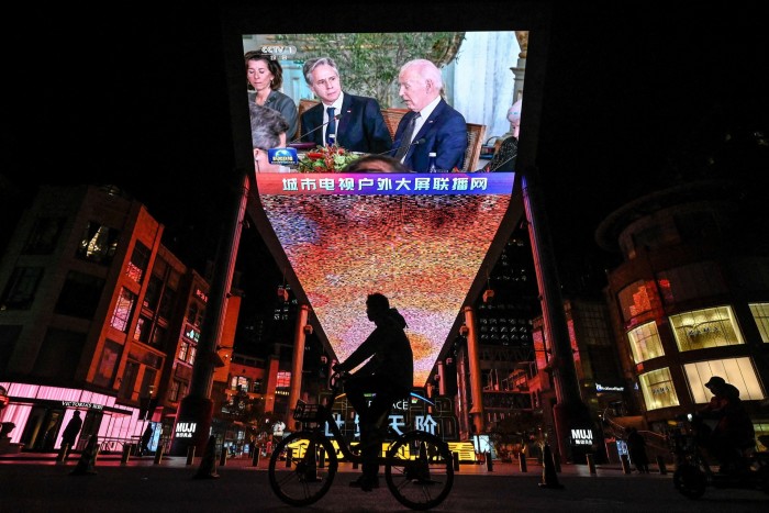 An outdoor screen in Beijing shows a news program about US President Joe Biden meeting Chinese President Xi Jinping during the Asia-Pacific Economic Cooperation Leaders’ week in California on November 16, 2023