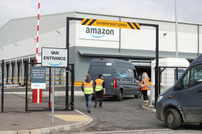 Electric delivery vans enter the Amazon warehouse in the Titanic Quarter, Belfast