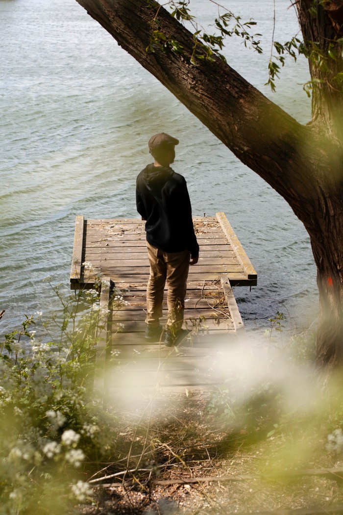 Runako Nyauchi stands on the dock of a pond