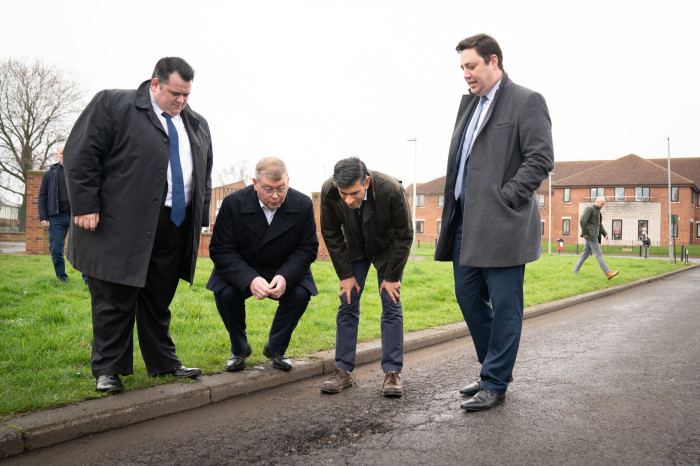 Rishi Sunak inspects a pothole on a visit to Darlington in 2023 with, from left, councillor Jonathan Dulston, Tory MP Peter Gibson and, right, Ben Houchen, mayor of Tees Valley