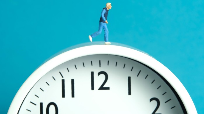 Miniature people toy figure photography. Running daily routine concept. A young men runner jogging above clock, isolated on blue background