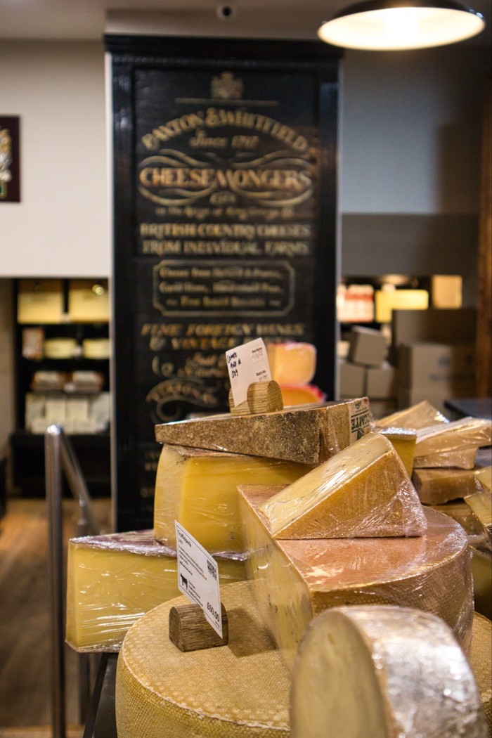 Hard cheeses on the counter at Paxton & Whitfield’s Jermyn Street store