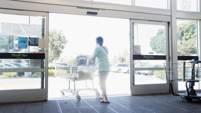 A woman leaves a California supermarket