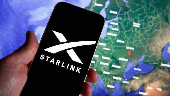 The Starlink photo is seen on a mobile device with Ukraine on a map in the background