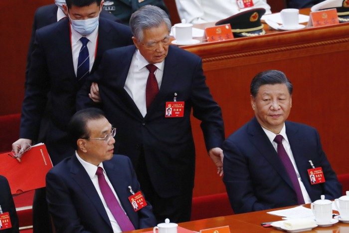 China’s former president Hu Jintao is led out of the 20th Chinese Communist party congress in Beijing