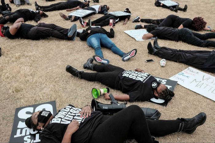 A ‘die-in’ outside World Of Coca-Cola in Atlanta, Georgia, after Coca-Cola did not oppose changes to voting laws that would make it harder for black voters to cast ballots