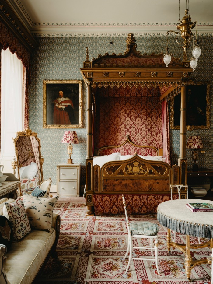 The Blue Bedroom with a state bed bearing the coat-of-arms of the Earl of Darlington and his second wife