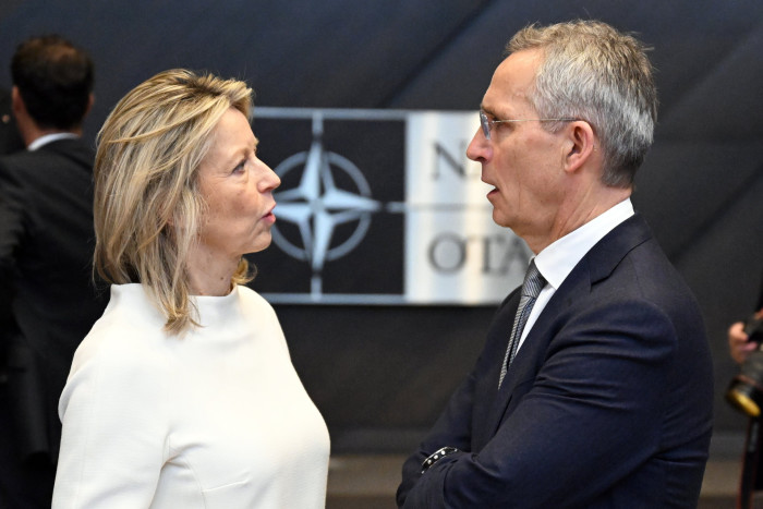 Dutch defence minister Kajsa Ollongren and Nato secretary-general Jens Stoltenberg in discussion