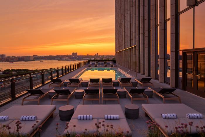 The outdoor pool boasts a sun deck and views over the Hudson River