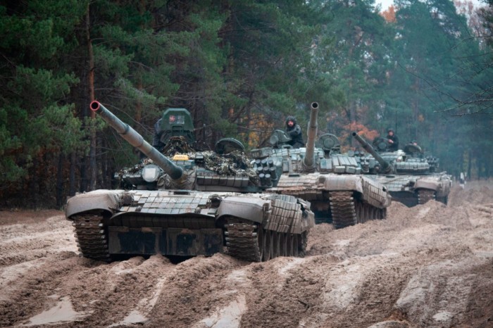Ukrainian troops operate what they said were captured Russian T-72 tanks near the Belarus border last October