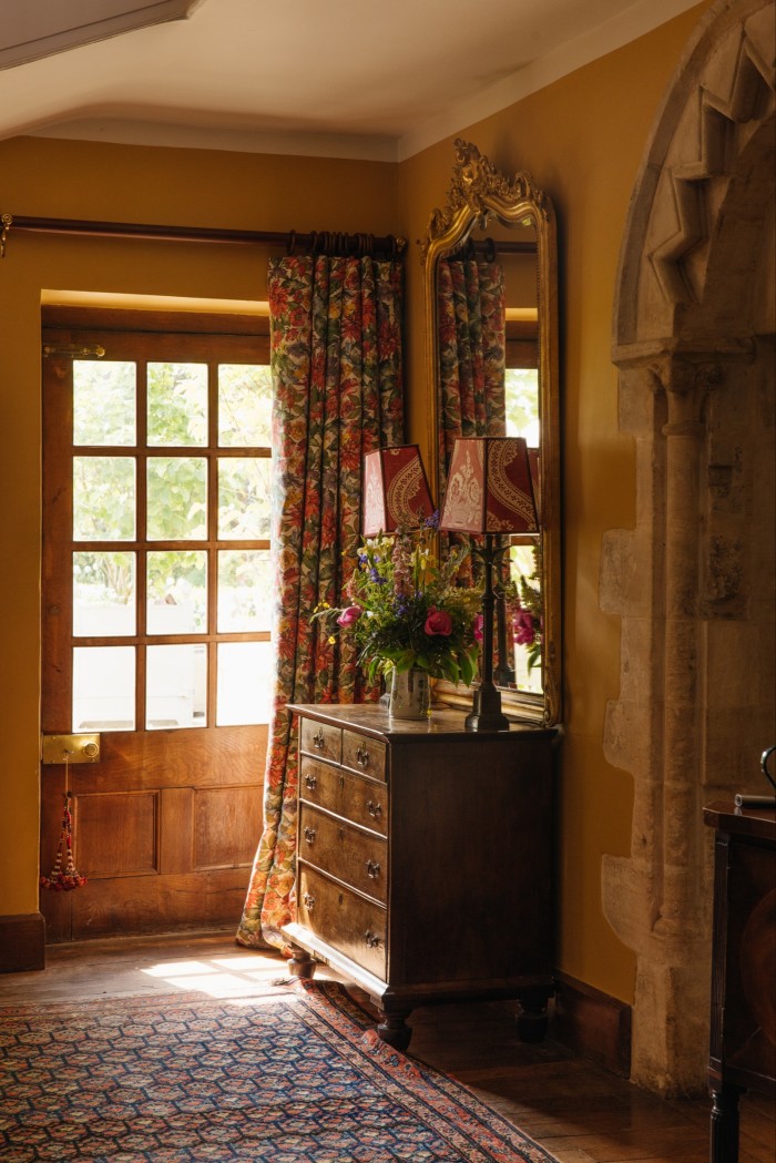 The hallway at Southrop Manor, with curtains in the new Bertioli Dahlia fabric