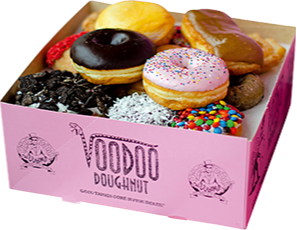A signature pink box from Voodoo Doughnut
