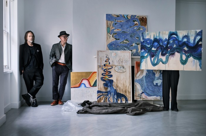 Thom Yorke (left) and Stanley Donwood in the exhibition space at Cromwell Place, with (from left) their artworks Frozen Raw, Beginning Without End, Membranes, Besuch, and One of Many, all 2022