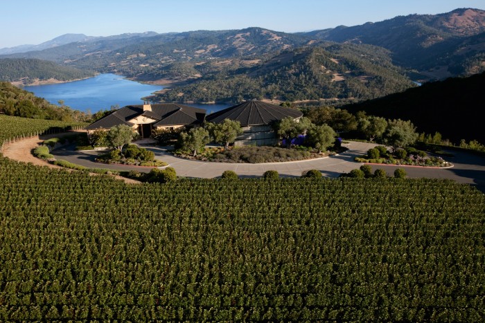 The IX Estate vineyard in front of Colgin Cellars’ winery, with Lake Hennessey in the background