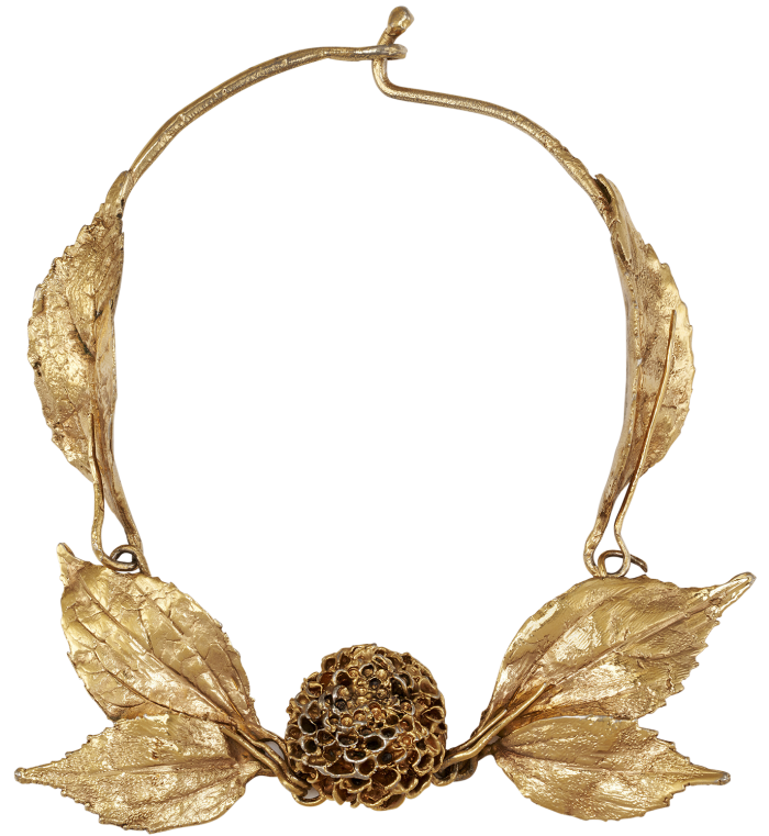 A large sculptural gold necklace with a round dahlia flower and leaves at the front