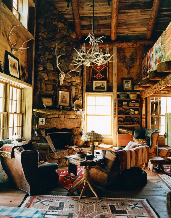 Furnishings in the Vance Cabin include a c1920 Navajo pictorial rug (on floor), c1920 Akimel O’odham basket (on mantelpiece) and a c1910 Shiprock Plateau blanket (on the banister)