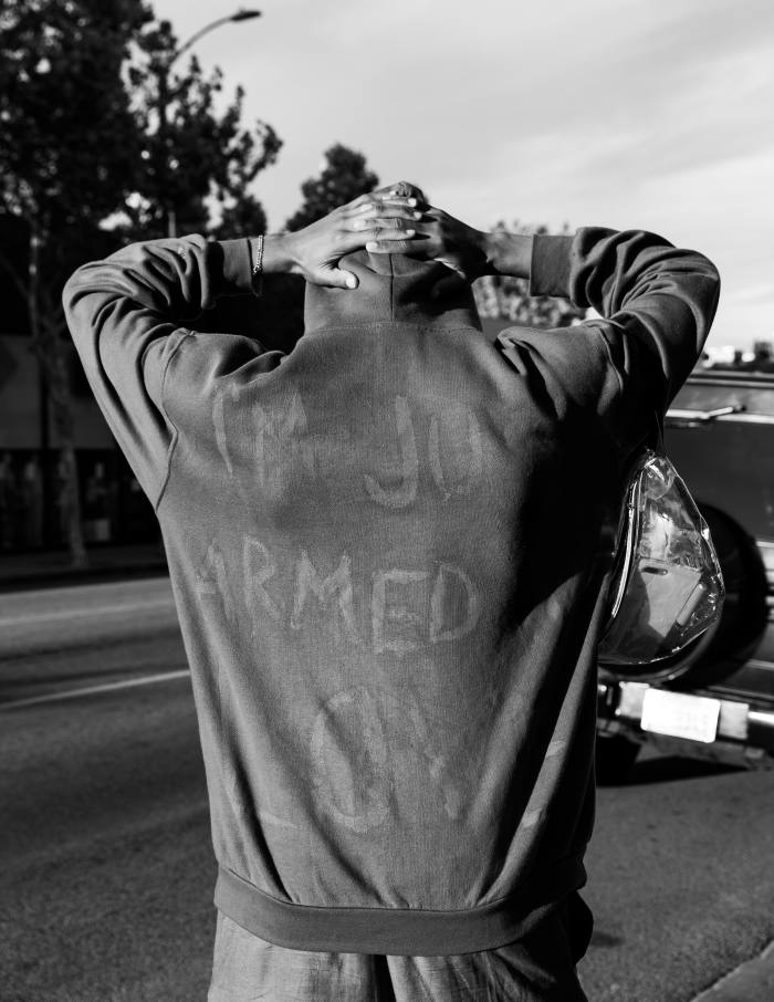 Fairfax, Los Angeles, May 30. A protester’s sweater reads ‘I’m Just Armed with Love’