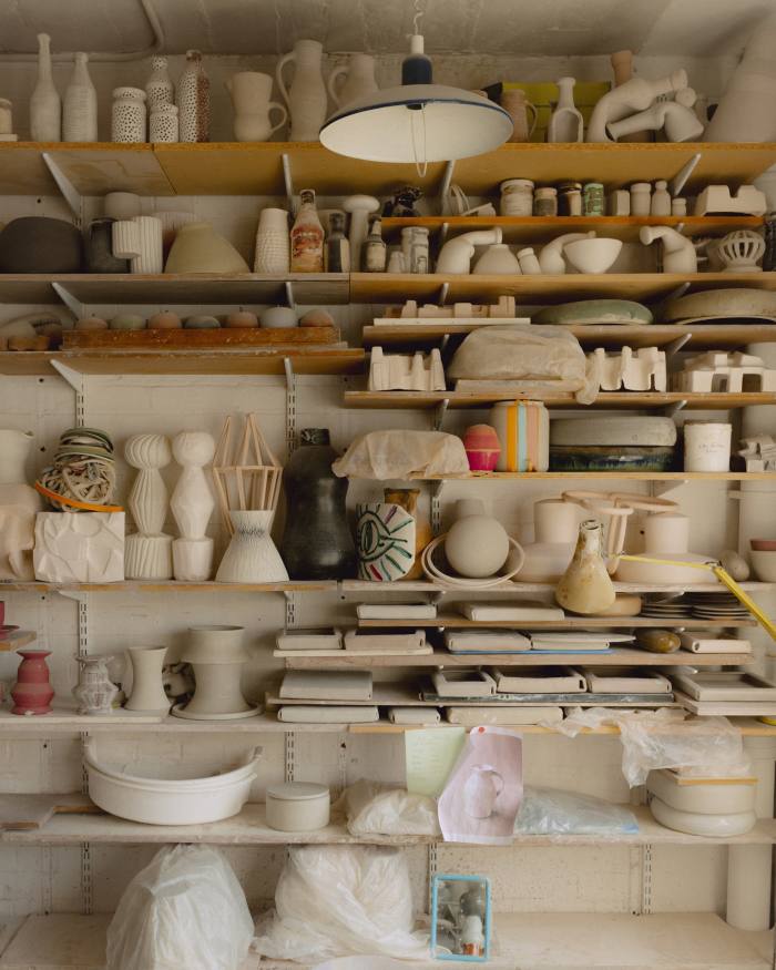 Shelves of ceramics inside Nicola Tassie’s studio