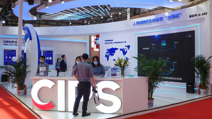 People visit the booth of cross-border interbank payment system (Cips) during China International Financial Exhibition at Shougang Park last years in Beijing