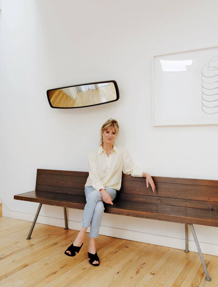 Amanda Levete at home in London, with convex mirror by Sebastian Wrong for Established & Sons and drawing by Michael Craig-Martin