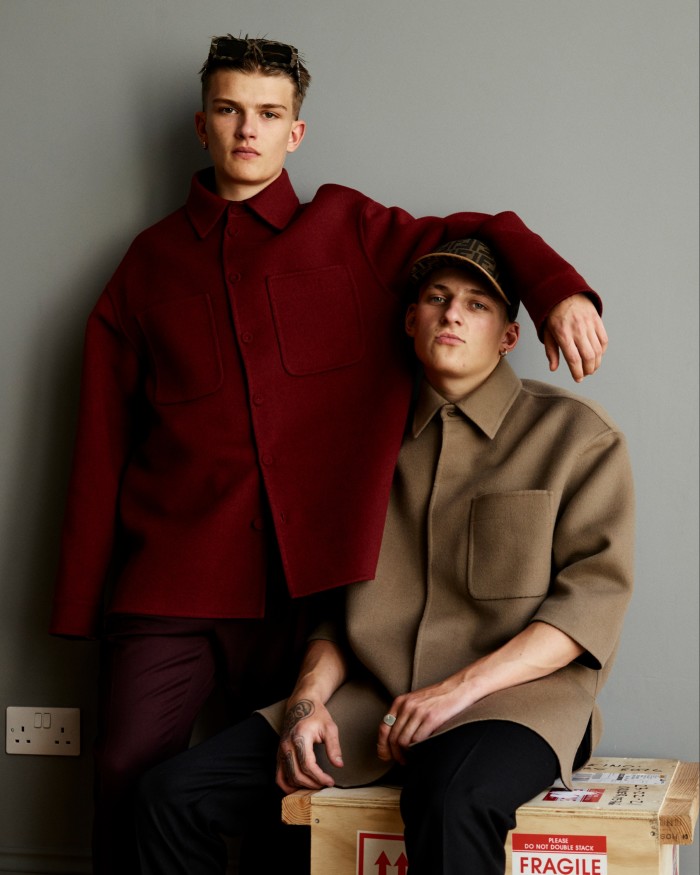 From left: William wears Fendi wool jacket, £2,450, wool trousers, £580, and sunglasses, £760. Bunney single gold earring (throughout), £1,710.  Charlie wears Fendi wool jacket, £2,150, wool trousers, £620, and cotton and leather hat, £385. Ring, model’s own