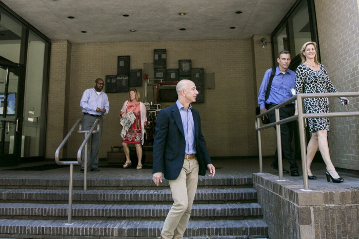 Jeff Bezos outside the Washington Post’s offices with former publisher Katharine Weymouth in 2013