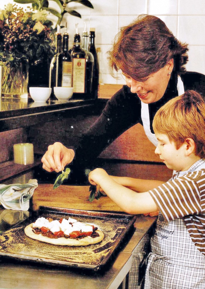 Clarke and her son Samuel cooking when he was a little boy