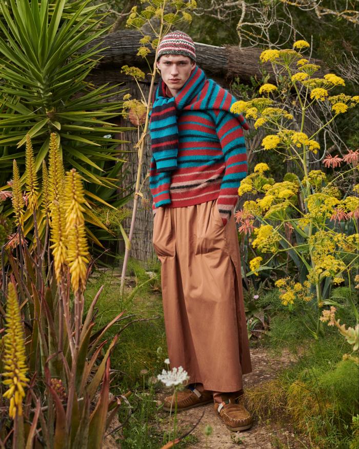 Paul Smith wool jumper, £350, and wool cardigan (around shoulders), £400. Umit Benan cotton kaftan, £920, cotton trousers, £590, and cotton hat, £170. Nick Fouquet – Federico Curradi suede and shearling shoes, £623