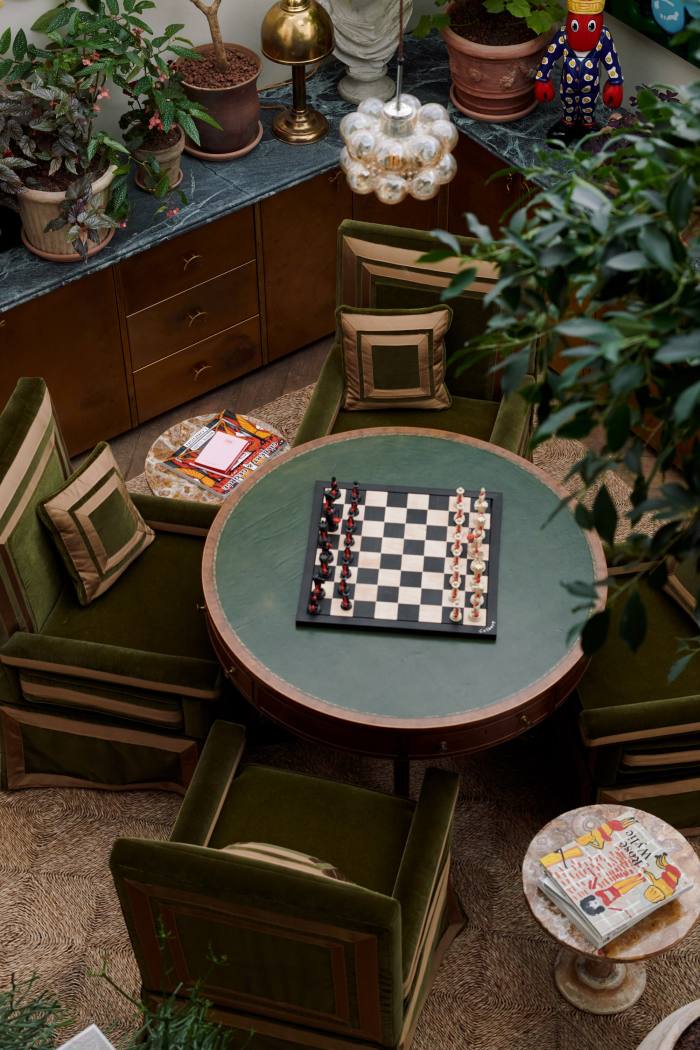 The games room, with a Philip Colbert lobster chess set on an antique card table and chairs by Buchanan Studio