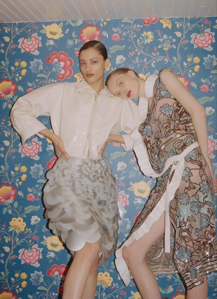 Chaima (left) wears Louis Vuitton scale-embroidered silk skirt and patent leather zipped jacket, both POA. Penelope wears Louis Vuitton embellished silk stained-glass dress, POA